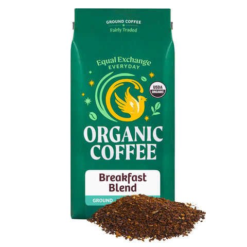 Green bag of Equal Exchange Everyday Organic Coffee Breakfast Blend with a pile of ground coffee