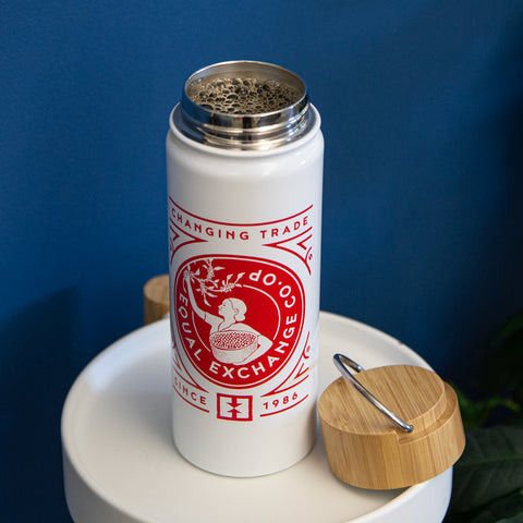 17oz insulated steel tumbler with white and red Equal Exchange graphics, filled with hot coffee