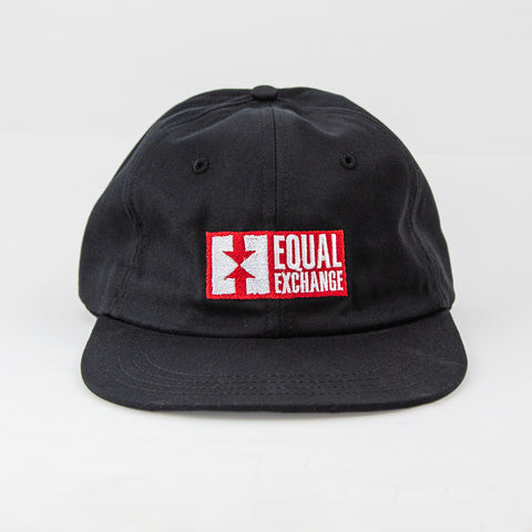 front view of black organic cotton dad hat with Equal Exchange logo