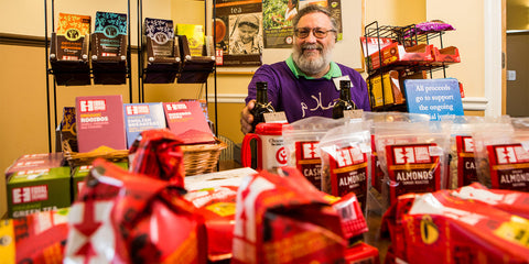 table sale set up with Equal Exchange products with organizer in the background