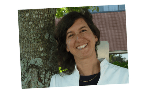 closeup of Equal Exchange Capital Coordinator Nicole Vitello standing next to a tree