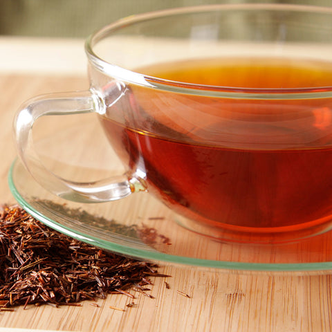 close up of a glass cup with brewed vanilla rooibos tea
