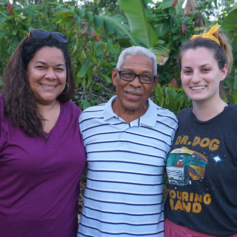 Jackie Rhone and Megan Chisholm of Equal Exchange stand together with Norberto Frías of CONACADO co-op in the Dominican Republic