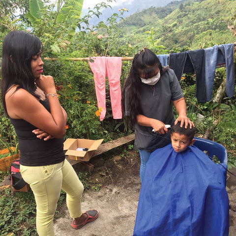 ASPROCAFE co-op members use microloan funding to run a backyard salon business