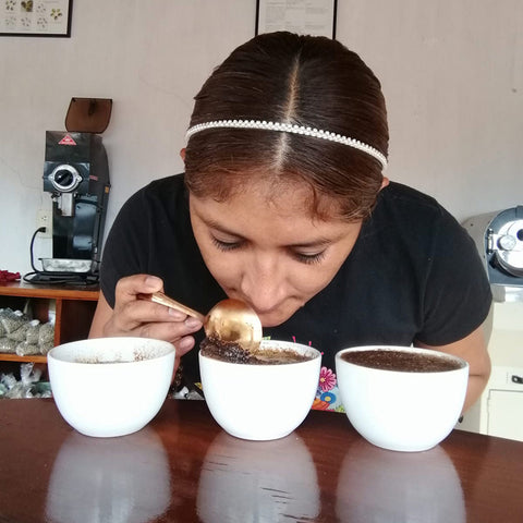 Quality Manager Alejandra Gurgua Ruiz of Comon Yaj Noptic co-op, cupping coffee