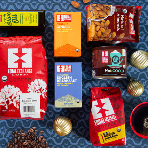 Collection of Equal Exchange coffee, tea, and other food items on a blue patterned background.