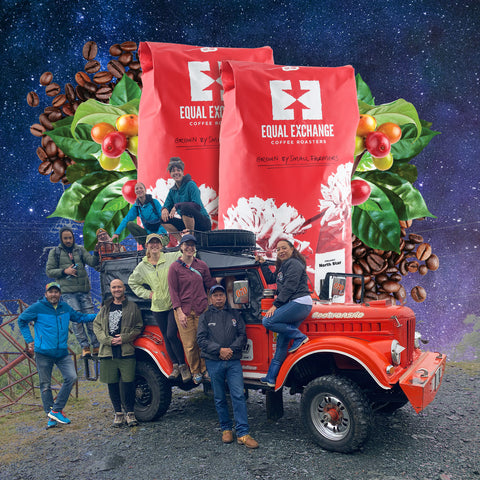 Group of people standing around a red jeep with Equal Exchange coffee bags and coffee beans in the background.