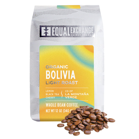 Equal Exchange organic Bolivia light roast coffee package on a white background and whole coffee beans