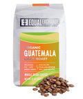 Coffee bag labeled 'Equal Exchange' with 'Guatemala Light Roast' on a white background and whole coffee beans