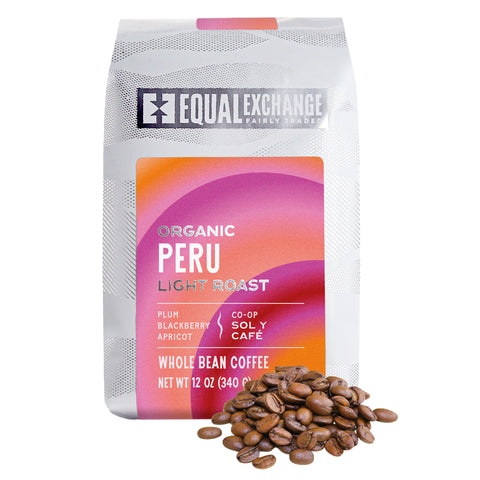 Coffee bag labeled 'Equal Exchange Organic Peru' with colorful design on a white background and whole coffee beans