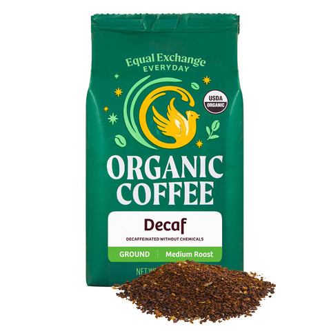 Green bag of Equal Exchange Everyday Organic Coffee Decaf with a pile of ground coffee