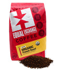 A red bag of Equal Exchange Organic French Roast coffee on a white background with ground coffee in front