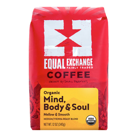 A 12 oz bag of Equal Exchange Coffee 'Organic Mind, Body & Soul' medium/vienna roast blend. The packaging is bright red with a white logo and a yellow label at the bottom.