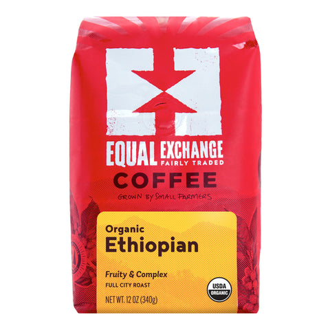 A 12 oz bag of Equal Exchange Coffee Organic Ethiopian, featuring a bright red packaging design with a white logo, black text, and a yellow label at the bottom.