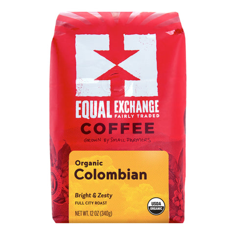 A 12 oz bag of Equal Exchange Organic Colombian coffee, featuring a bright red packaging design with a white logo and a yellow label at the bottom.