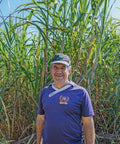 Eulogio Zaracho, sugar farmer and member of Manduvira co-op in Paraguay, standing in his cane field