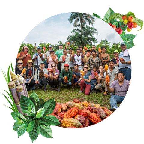 group of Equal Exchange staff and ACOPAGRO cacao farmers in Peru holding orange and red cacao pods