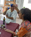 two people raising their glass at a table