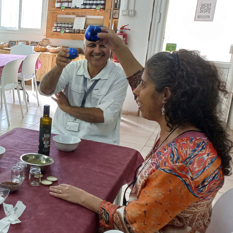 two people raising their glass at a table