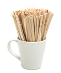 Wooden coffee stirrers in a blank white mug