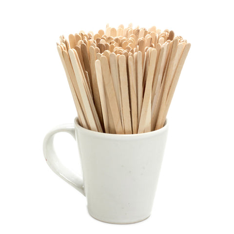 Wooden coffee stirrers in a blank white mug