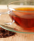 close up of a glass cup with brewed vanilla rooibos tea