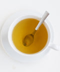 cup of peppermint tea with spoon