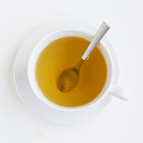 cup of peppermint tea with spoon
