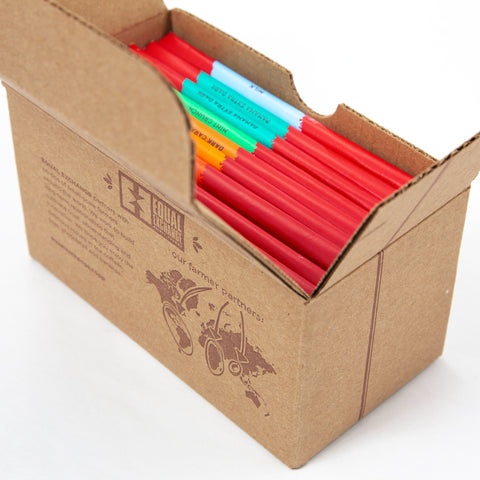 open recycled cardboard gift box with assortment of chocolate bars inside